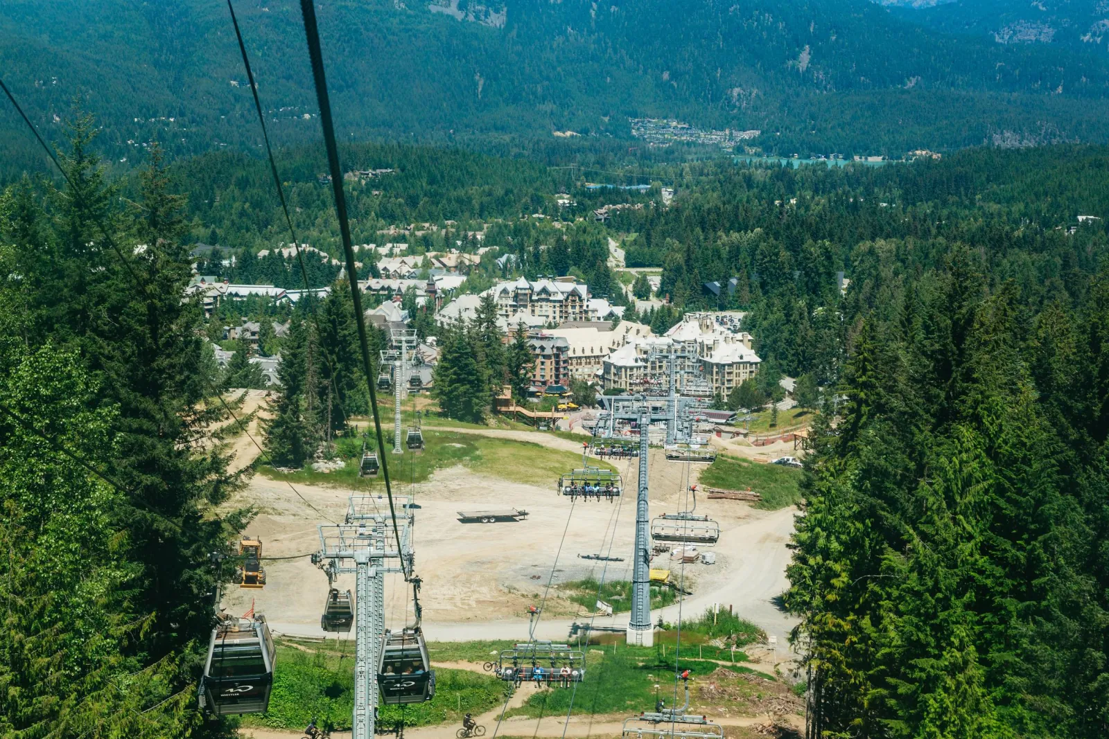 View down the gondola line to Whistler Village and the green valley in summer